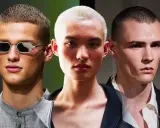 Tre volti con capelli cortissimi, un uomo con occhiali decorati, un altro con un taglio buzz cut donna, e un terzo con sguardo intenso.