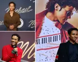 Jaafar Jackson, che interpreta Michael Jackson nel film, sorride con un completo nero e una giacca con dettagli dorati.